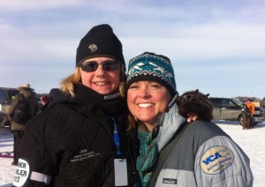 Dr. Van Duine (r) with friend & fellow mushing enthusiast Donna at the start of Iditarod 2013. See what I mean, great smile!