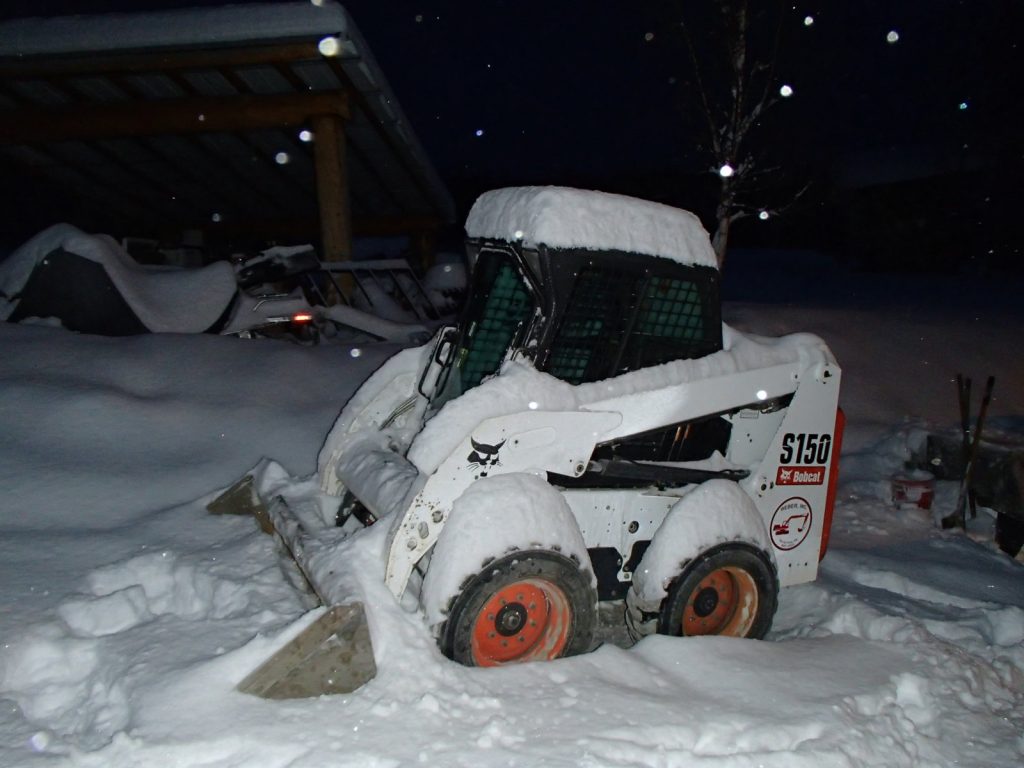 Dan had the bobcat plugged in over night in preparation for snow removal today